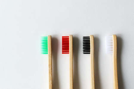 Four multi-colored bamboo toothbrushes. Eco friendly stuff concept. Copy space. Horizontal orientation. Top view.の写真素材