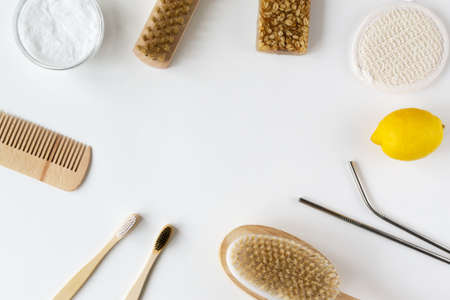 Wooden hair comb, face wash, hand made oatmeal soap, soda, lemon, metal drink straws, brush, bamboo toothbrushes. Eco friendly stuff concept. Horizontal orientation. Top view. Copy space.の写真素材