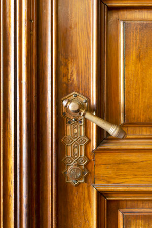 Chernivtsi, Ukraine - August 5, 2021. Antique doorknob on a wooden door between the Marble and Red halls. UNESCO World Heritage Site.Residences of the Metropolitans of Bukovina and Dalmatia.のeditorial素材