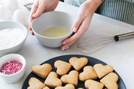 Creation of icing. Finished cookies need to be decorated. The process of making holiday cookies for...