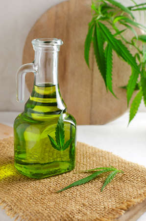 Cannabis CBD hemp oil in a glass bottle. The concept of Alternative Oil. vertical orientation. selective focusの写真素材