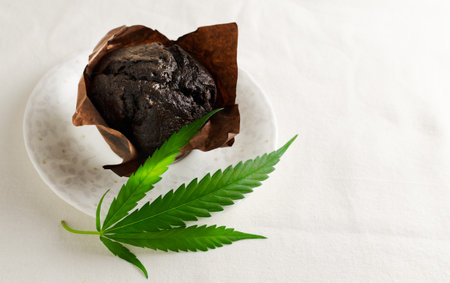 Marijuana cupcake muffins with cannabis leaves. gluten-free. Alternative sweet concept. horizontal orientation. selective focus. copy spaceの写真素材