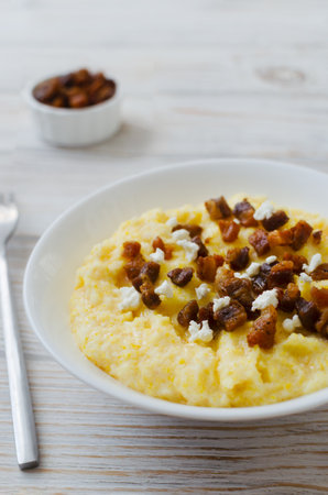 Authentic Hutsul banosh with bryndza and cracklings served in a simple style. Traditional dish of the Ukrainian Carpathians, symbolizing hospitality, culture and the taste of home cooking.の写真素材