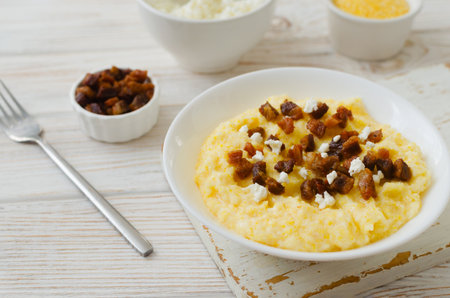 Authentic Hutsul banosh with bryndza and cracklings served in a simple style. Traditional dish of the Ukrainian Carpathians, symbolizing hospitality, culture and the taste of home cooking.の写真素材