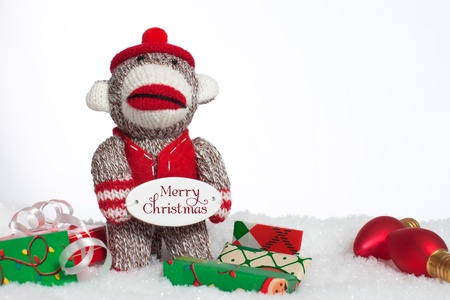 Christmas sock monkey with presentsの写真素材
