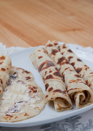 Traditional Norwegian holiday lefse rolled on a plate