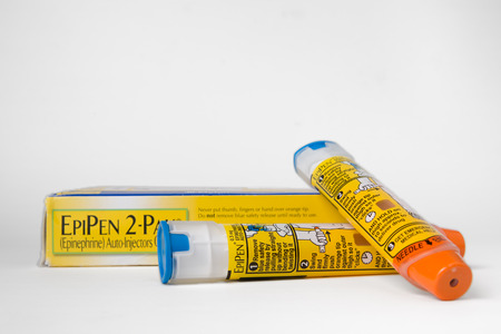 SAINT LOUIS, UNITED STATES - AUGUST 25, 2016: Two EpiPen auto-injectors used for treatment of allergic reactions.