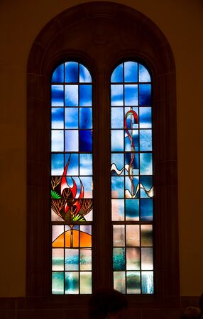 Saint Louis, United States-March 11, 2015: Stained glass window by Emil Frei Jr. depicting stylized burning bush at Hope United Church of Christのeditorial素材