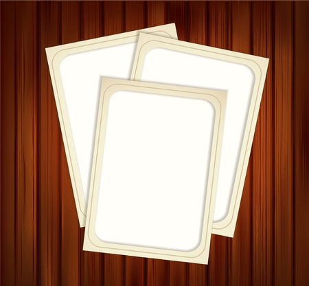 vintage photo frames on wood backgroundのイラスト素材