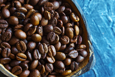 coffee beans in coconut plates. Close-up. Top view