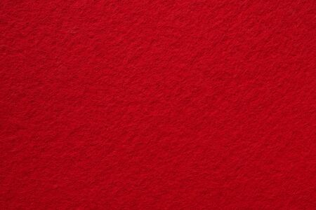 Textured background of red felt. Close-up. Template for designの写真素材