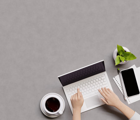 Overhead shot of office desktop. Person using a laptop computer. Top view with copy space, flat lay....