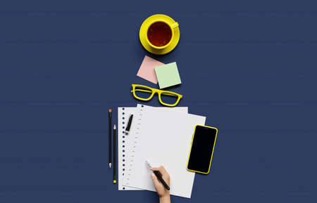 Office, business utensils on a blue table table, telephone, a cup of tea, pencils, a notebook, glasses, a plant in a pot. Hand signing the document. 3d illustration. Render.の写真素材