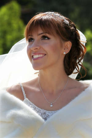 happy beautiful bride smiling in her wedding dayの写真素材