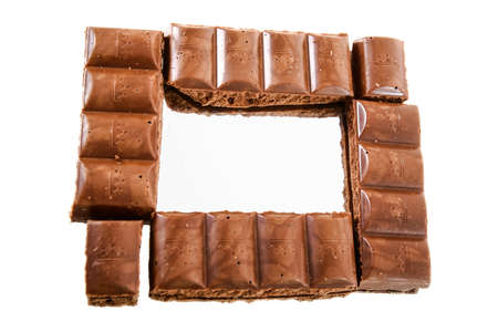 brown porous milk chocolate on mirror surfaceの写真素材