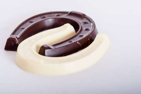 white and milk chocolate horseshoe figuresの写真素材