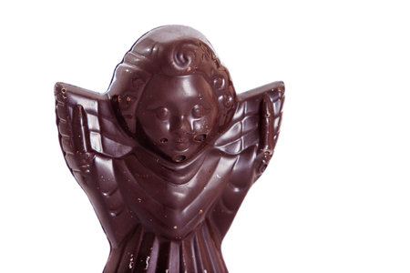 milk chocolate angel figure isolated on white backgroundの写真素材