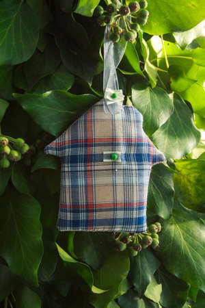 house handmade toy on design green New Year tree isolated on white backgroundの写真素材