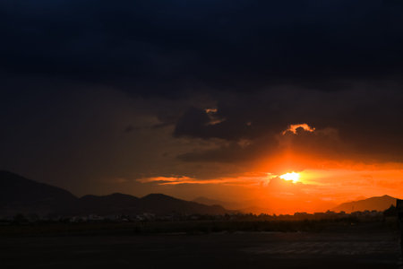 panorama of fantastic sunset above hills resort city and bayの写真素材