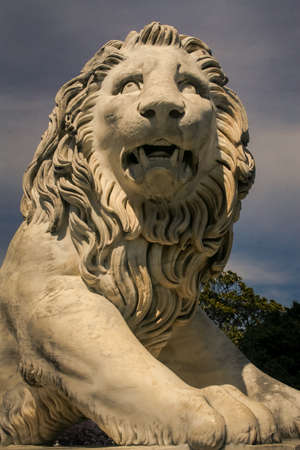 closeup head of old white marble lion sculpture in Crimea Vorontsov palace park in springtimeのeditorial素材