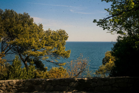 panorama of azure sea from Vorontsov palace park under sunlight in Crimea in springtime