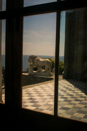 large lion sculpture in front of Vorontsov palace at marble floor through window in Crimea Ukraineのeditorial素材