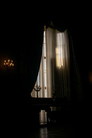 Crimea Vorontsov palace interior dark room lit with window light and candlesのeditorial素材