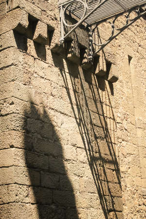 closeup shade on sandstone wall from small metal lacy bridge in Vorontsov palace in Crimea Ukraine in springのeditorial素材