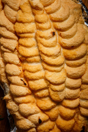 top view closeup whipped egg whites cover of baked dorado on foil
