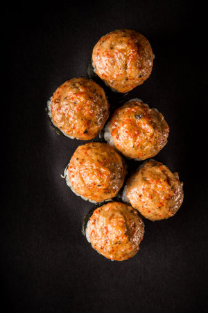 top view closeup baked roll with mushrooms, tomatoes, philadelphia cream cheese decorated with nori,...