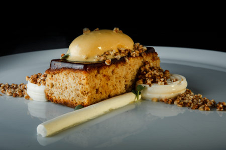 original baked dessert without sugar and gluten decorated with chocolate and white cream on black...