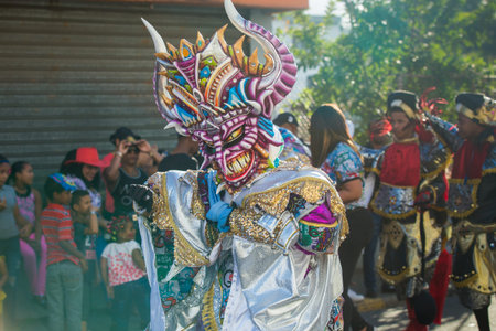 Concepcion De La Vega, DOMINICAN REPUBLIC - FEBRUARY 11, 2019: native man defile in colorful costume...