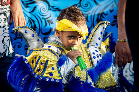 Concepcion De La Vega, DOMINICAN REPUBLIC - FEBRUARY 09, 2020: closeup small boy in pied costume...