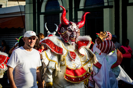 Concepcion De La Vega, DOMINICAN REPUBLIC - FEBRUARY 09, 2020: closeup human in red devil and...