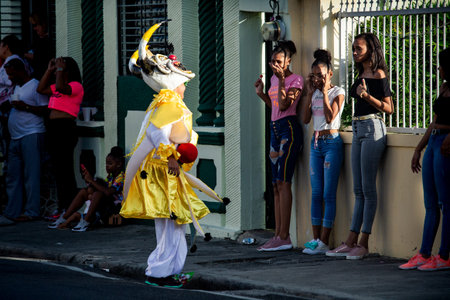 Concepcion De La Vega, DOMINICAN REPUBLIC - FEBRUARY 09, 2020: young boy in scary yellow clown...