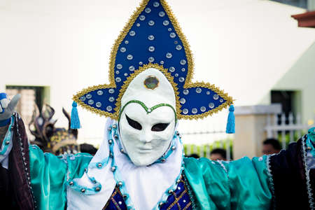 Concepcion De La Vega, DOMINICAN REPUBLIC - FEBRUARY 09, 2020: closeup human in original sparkling costume poses for photo at dominican carnival on February 9 in Concepcion De La Vegaのeditorial素材