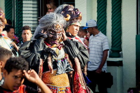Concepcion De La Vega, DOMINICAN REPUBLIC - FEBRUARY 09, 2020: closeup man in shiny black demon mask...