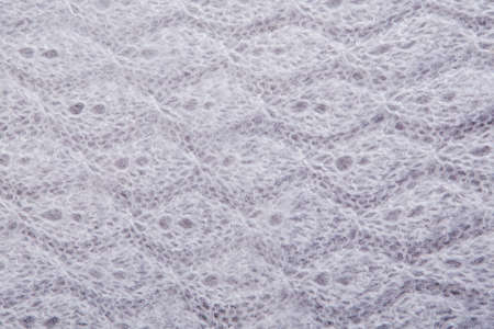 top view macro handmade binding grey, knitted, woolen shawl with patternの写真素材