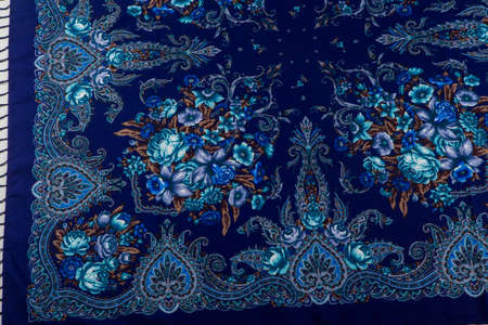 top view part of bright blue paisley floral pattern on dark blue cotton female shawlの写真素材