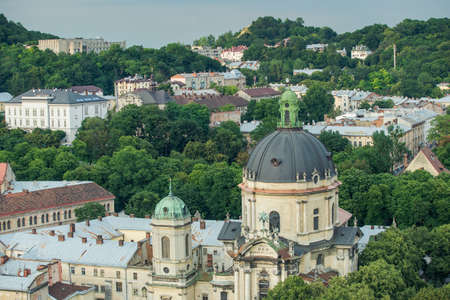 aerial view on Dominican cathedral and other Lviv historical buildings and green trees in summertime in Ukraineの写真素材