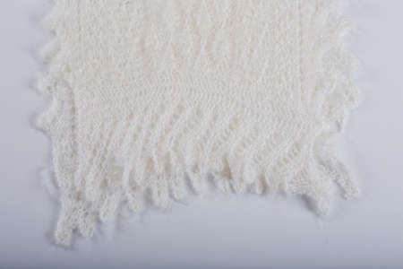 top view closeup folded handmade gray woolen scarf with knitted pattern designed in flat lay on gray backgroundの写真素材