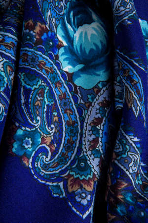top view part of blue paisley floral pattern on dark cotton female shawlの写真素材