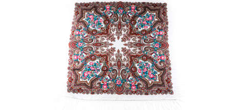top view on flat white cotton scarf with fringe and bright floral ornament with golden, brown and yellow colors lay on white backgroundの写真素材