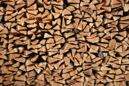 A pile of wooden logs laid together                                 の写真素材