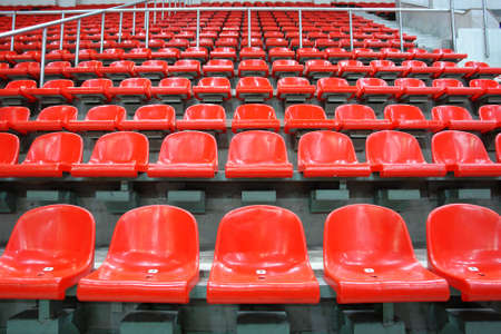 Red sittings of stadium's stand  の写真素材