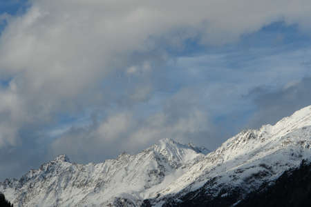 Snowy peak of mountain in the sky 2  の写真素材