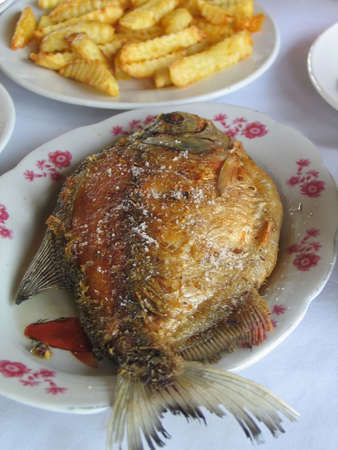 Dish of fried fish with chipped potatoes  の写真素材