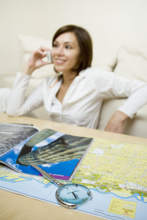 Attractive young woman speaks by phone   