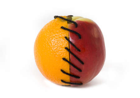 Half of apple and orange tied together  の写真素材