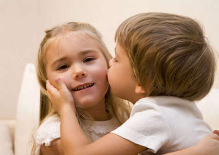 Little boy kiss his sister  の写真素材